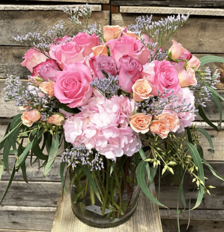 Not just an ordinary bouquet of roses, these amazing pastel colored roses are filled with hydrangeas and other elegant greenery to bring a smile to moms face or any special lady you love.