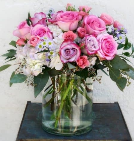 Not just an ordinary bouquet of roses, these amazing pastel colored roses are filled with hydrangeas and other elegant greenery to bring a smile to moms face or any special lady you love.