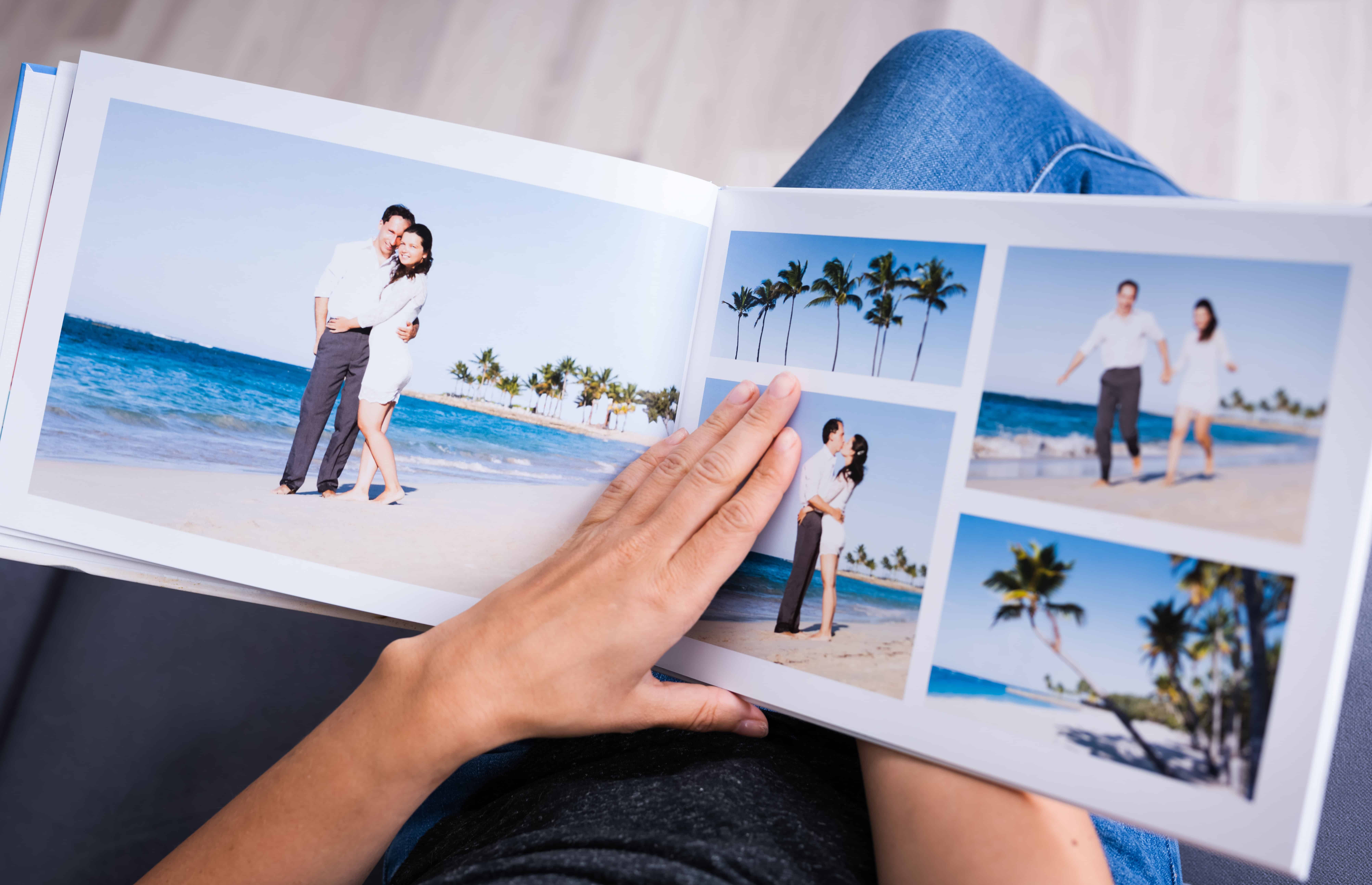 open photo book with pics of couples on beach